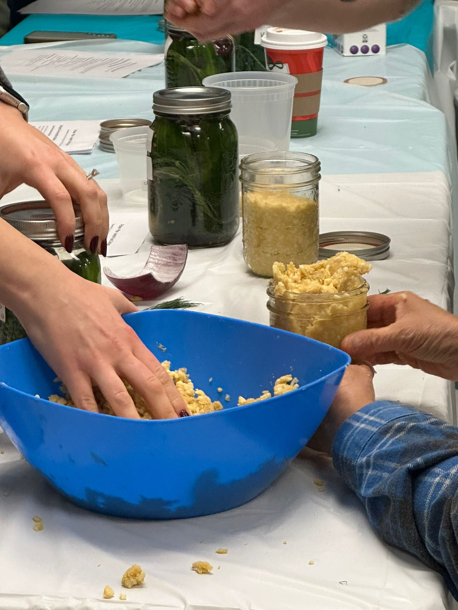 Hands preparing miso